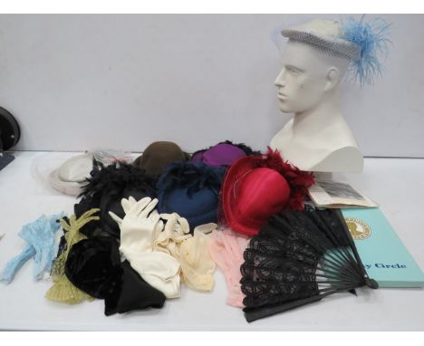 Selection of vintage ladies hats, gloves and stockings.
