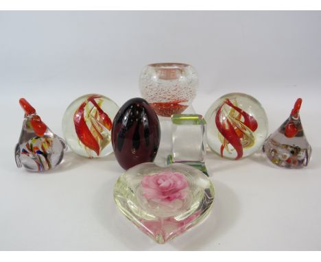 8 Various art glass paperweights.