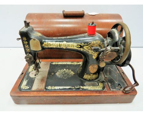 Vintage Singer sewing machine with wooden hard carry case. Working order. See photos. 