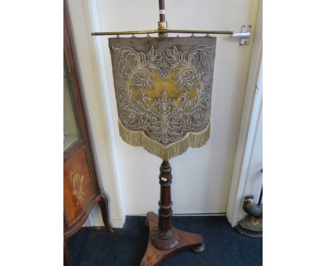 Mahogany based fire screen with beadwork pendant hanging screen. Tricorn feet.   See photos. 