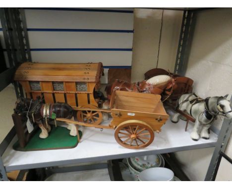 3 Large ceramic horses plus 2 carts and a bow top caravan.