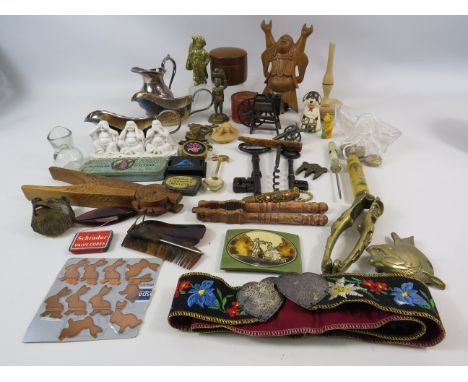 Interesting mixed lot of collectables including belt buckles, nut crackers etc.