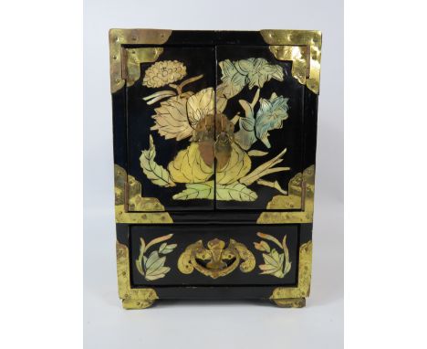 Oriental jewellery box with mother of pearl inlay and brass fittings, approx 8 1/4" tall 6" wide and 4.5" deep/