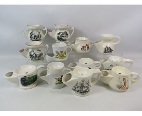 12 Vintage ceramic shaving mugs.