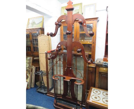 Lovley late Victorian/Edwardian Mahogany Hall stand with turned hat racks on scrolled limbs. Scrolled arm stick or brolly sta