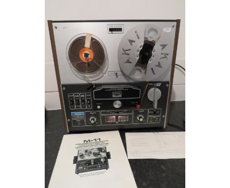 AKAI GX-M-11D Stereo Tape Recorder. No packaging. Lights come on when plugged in but working condition unknown. Sold as seen.