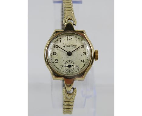 Ladies Breitling watch set in 9ct Yellow Gold Case. Gold tone expanding strap.  Non runner for spares or repairs. See photos.