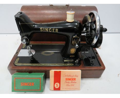 Very nice example of a Vintage Singer sewing machine in excellent condition. Model 99K. Original instruction manual.  Hard ca