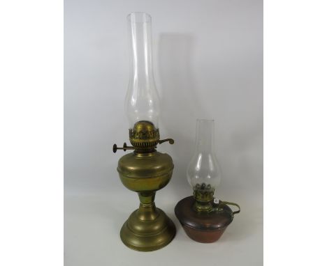 Brass duplex oil lamp and a copper chamber stick oil lamp.