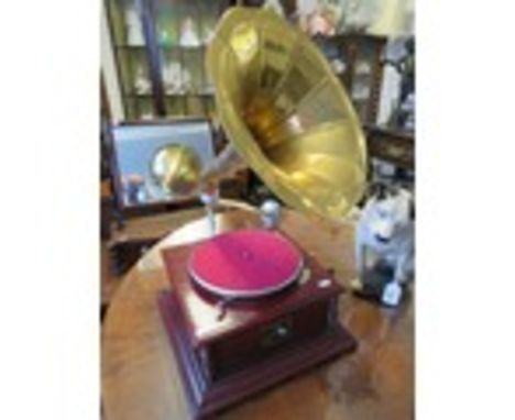 Replica of a vintage HMV wind up turntable in working order with large brass trumpet shaped speaker. Will play records but no