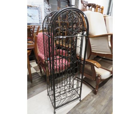  Wrought metal wine storage stand with locking front door. Excellent condition which measures H:54 x W:18 x D:15 Inches. See 