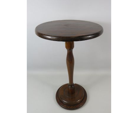 Very pretty little turned Oak wine table with circular top measuring 12 inches in Diameter. 19 inches tall. See photos.  