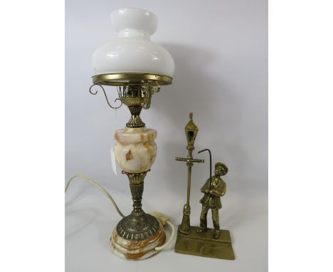 Onyx and brass oil lamp and a brass figurine of a lamp lighter.