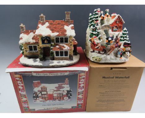 Regency fine arts fibre optic light up house plus an 'Avon' musical waterfall.   See photos.   S2