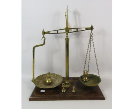 Set of W &amp; T Avery brass balance scales on a wooden base. Approx 19" tall.