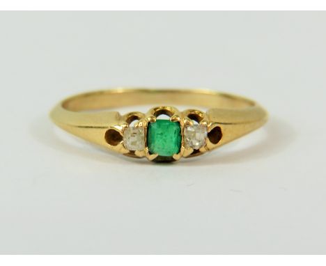 Ring set with central Emerald and flanked by twin Diamonds. No hallmark visable but chem testing to 14ct or higher.  Finger s