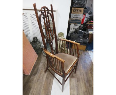 Pretty Art Nouveau inspired high backed stick chair with turned details.   