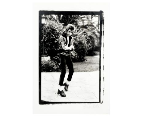 Mick Rock (British, born 1944): David Bowie, Beverly Hills,1972, printed later,a full-length black and white portrait, signed