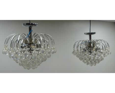 Two contemporary metal light fittings with curved branches and faceted acrylic droplets, W40cm, H35cm