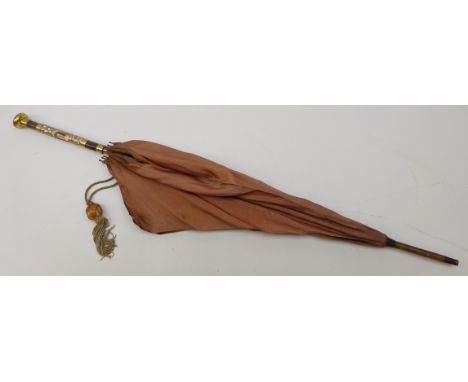 19th/ early 20th century silk parasol, bamboo shaft, gilt metal handle and mounts with porcelain plaque, painted with a portr