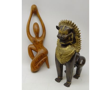 Chinese cast Lion Dog with brass detail, H41cm and a hardwood carved model of a nude woman (2)