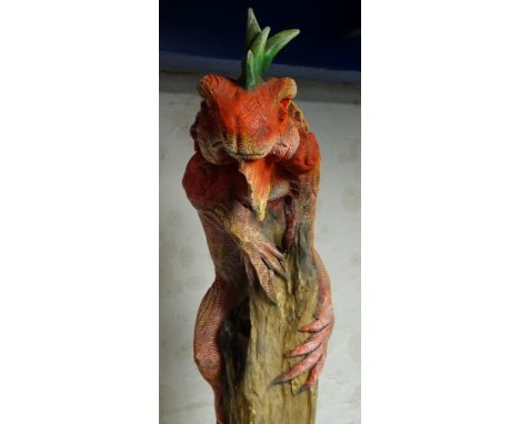 Large painted model of an Iguana naturalistically mounted on tree trunk, H216cm 