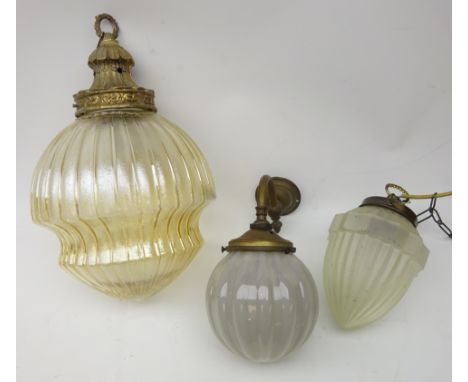 Early 20th century wall mounted light fitting, brass mount with globular lobed glass shade and two other pendant glass light 