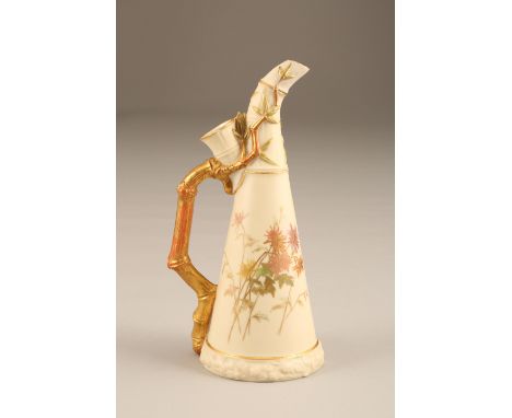 Royal Worcester blush ware ewer, conical form with a gilt bamboo handle, decorated with hand painted flowers. Date coded 1889