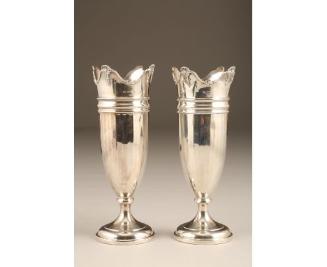Pair 1920s silver spill vases faceted bodies raised on circular feet, undulating rims with scallop finials. Assay marked Birm