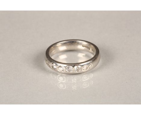 Ladies platinum wedding band set with eight round brilliant cut diamonds. Total diamond weight 0.40 carats. Ring size M