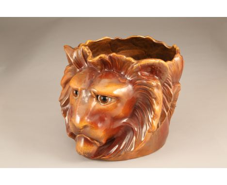 Bretby pottery lion mask planter with glass eyes. Height 30cm