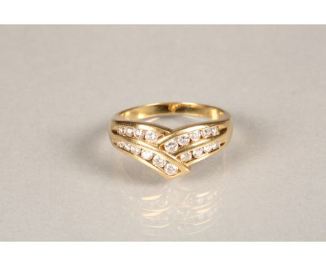 Ladies 18 carat gold wishbone diamond ring, set with nineteen graduated brilliant cut diamonds. Ring size P Ring is in very g