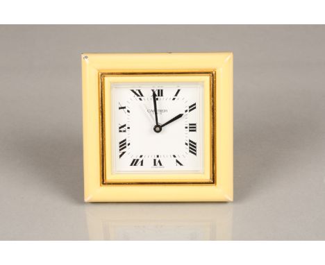 A Cartier travel clock white dial with Roman numerals. Quartz movement. 7cm high