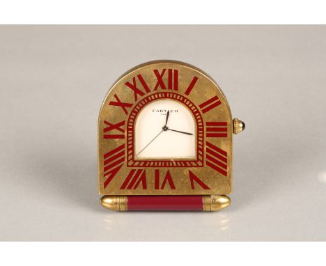 A Cartier folding travel clock with gilded case and quartz movement. Model number 357202594. 5cm high