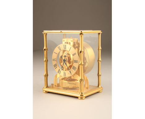 Jaeger LeCoultre Atmos clock brass four glass case with gilt roman numeral chapter ring with original case. Height 22.5cmCloc