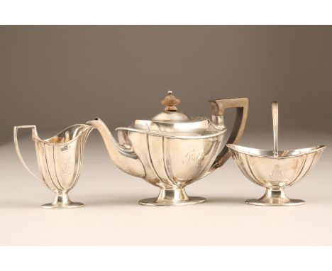 Edwardian three piece oval shaped silver tea service engraved coat of arms, assay marked Sheffield 1901. Total weight 620g