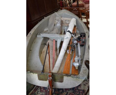 A Gull sailing dinghy, moulded hull, mast, gib and sail, Seagull outboard engine, oars. 340cm LOA (bow to stern).