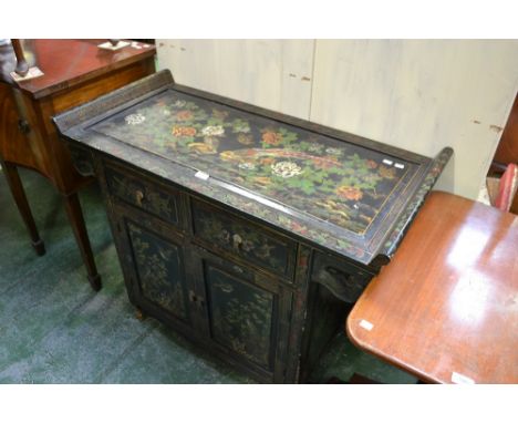 An Oriental japanned altar cabinet, rectangular top, outswept ends, two short drawers over two fielded panel doors to base, d