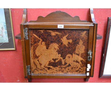 A mahogany smokers cabinet, with decorative panel door 