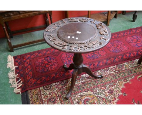 A William IV tripod table, carved circular top, baluster column, cabriole legs, circa 1830. 66cm high x 61cm diameter.