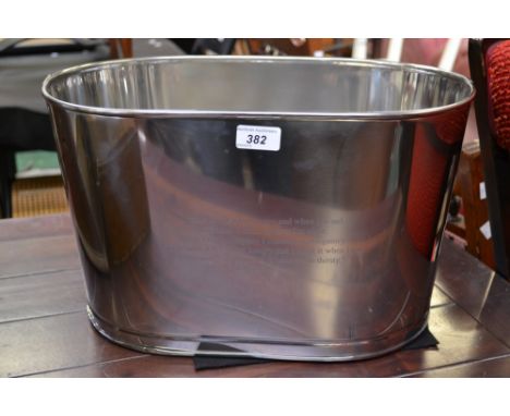 A modern chrome reproduction champagne trough, inscribed with Lily Bollinger quote 'I drink it when I'm happy and when I'm sa