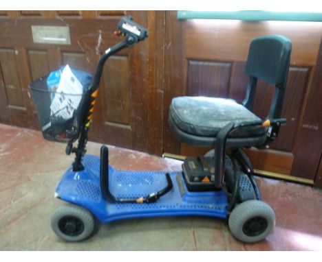 Little Diamond battery powered mobility scooter with manual, charger and cover