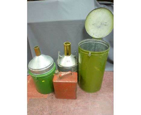 Two vintage oil containers in tin storage drums and a vintage petrol can with screw-on lid