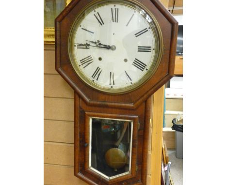 Victorian walnut cased pendulum wall clock, the dial set with Roman numerals, 79 cms high, 43 cms wide