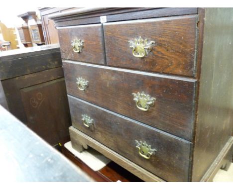 Neatly proportioned vintage oak chest of two short of two long oak lined drawers having fancy brass backplates and swan neck 