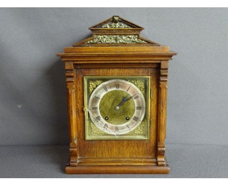 Polished steeple topped bracket clock with brass face