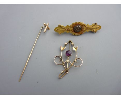 Fifteen carat gold oblong bar brooch, 2.7 grms, a nine carat gold seed pearl and sapphire pendant, 1.2 grms and a believed go