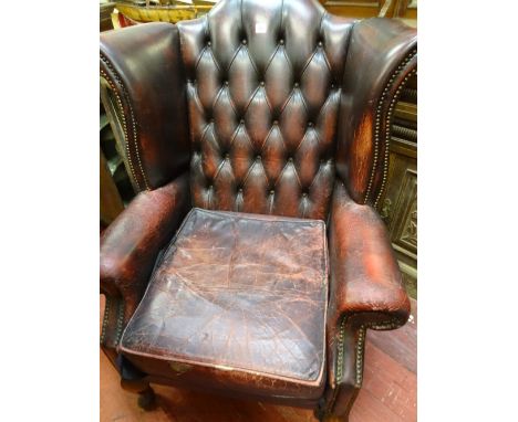 Button backed burgundy 'Ox Blood' leather wingbacked armchair