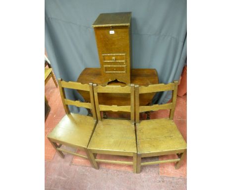 Three antique oak farmhouse chairs, a vintage oak sewing cabinet and contents and an oak barley twist gate leg dining table