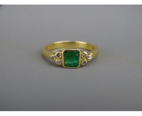 Eighteen carat gold ring with square shaped emerald surround by three flanking diamonds either side, size 'N/O', approximatel